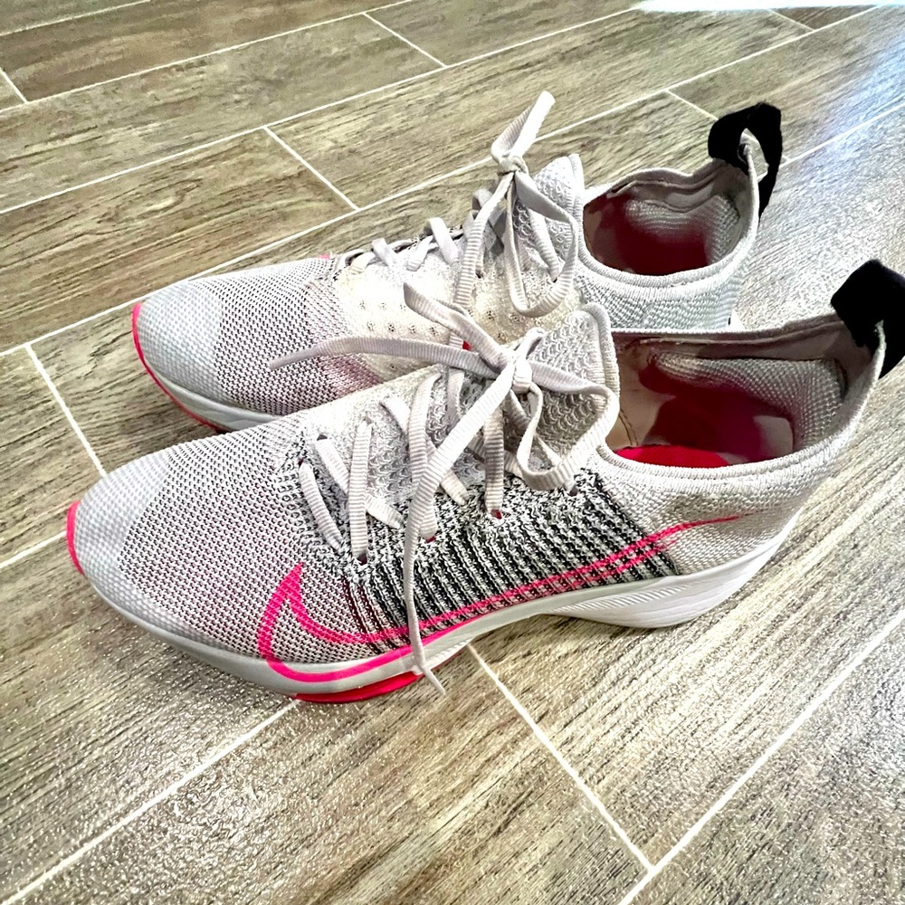 Nike pink training shoes.